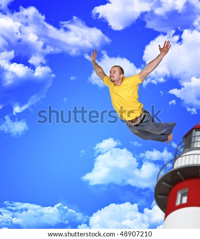 young man fly away in blue cloudy sky