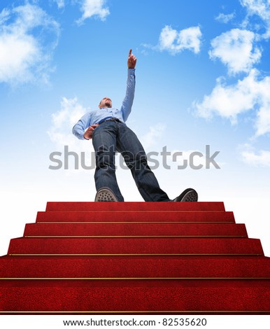 standing man and stair with red carpet