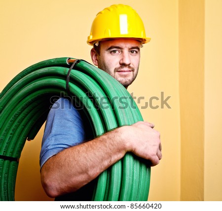 portrait of caucasian manual worker with pipe