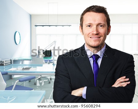 confident businessman and modern office background