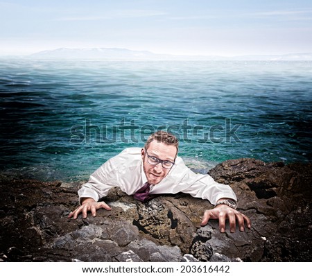 castaway businessman climb the cliff