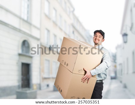 smiling delivery man with boxes