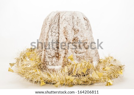 Pandoro italian Xmas cake with golden decoration over white background