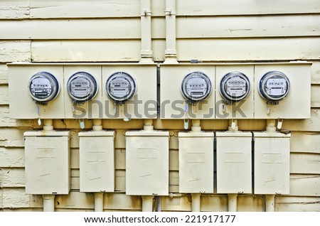 Horizontal Shot Of Electric Meters On Old House