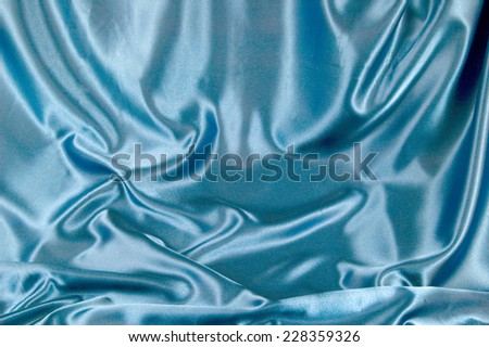 Soft Blue Horizontal Satin Background/ Beautiful Blue Background/ A soft light blue satin material background with gentle folds