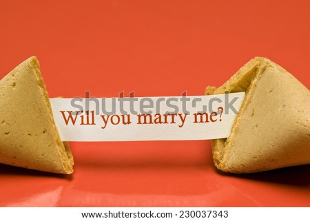Horizontal Close Up Shot Of Broken Fortune Cookie With Paper Saying, Will You Marry Me?