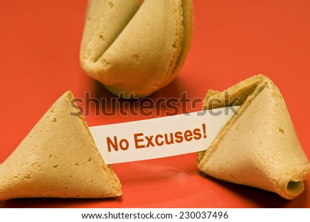 Fortune Cookie Broken Saying \'No Excuses!\'.  Horizontal shot