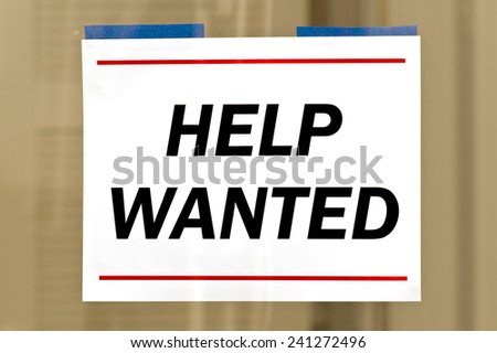 Help Wanted Sign Taped To Business Door