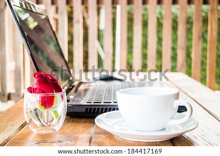 Comfortable work station with laptop and coffee, stock photo