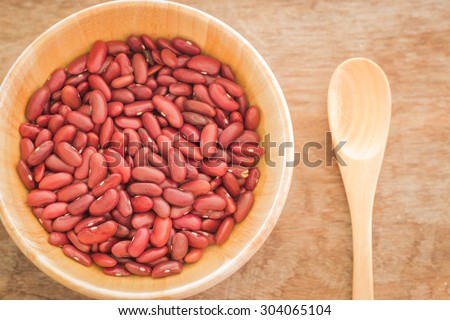 Raw red kidney bean in wooden bowl, stock photo