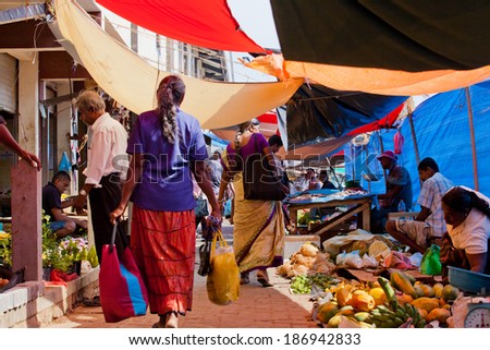 Sri Lanka - Sellers on street market in Matara, April 2, 2014