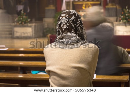 Faithful woman with head lace veil during the traditional latin catholic mass Stock fotó © 