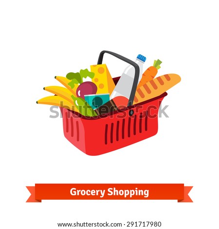 Red plastic shopping basket full of groceries. Supermarket or local store.