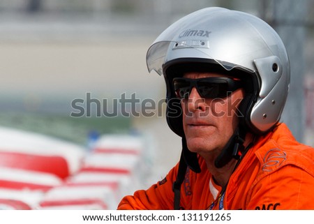 BARCELONA - MARCH 3: Track Marshal watches the track during Formula One Test Days at Catalunya circuit on March 3, 2013 in Barcelona, Spain.