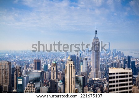 NEW YORK CITY - JUNE 17, 2014: Lower Manhattan skyline on hazy morning. Manhattan has been described as the economic and cultural center of the United States.