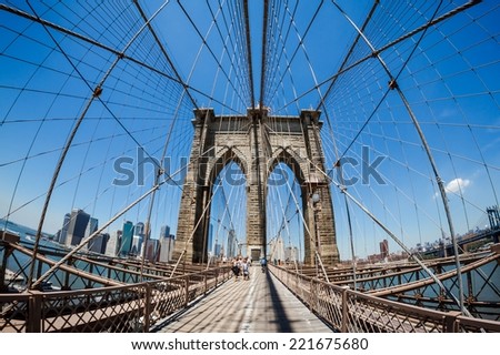 NEW YORK CITY - JUNE 16, 2014: The Brooklyn Bridge seen from its pedestrian walkaway. Approximately 4,000 pedestrians and 3,100 cyclists cross this historic bridge each day.