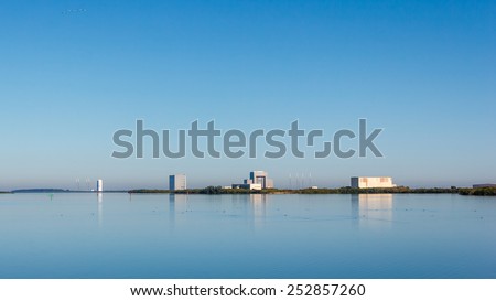 [2014-12-14]Cape Canaveral Air Force Station, Florida. Solid Motor Assembly Building, Vertical Integration Building, Launch Complexes LSC-37, LSC-40 and their reflections on banana river are visible.