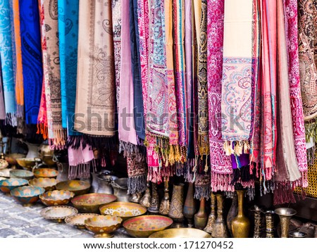 Colorful scarves and other souvenirs sold on a local market in Baku, Azerbaijan. Landscape orientation.