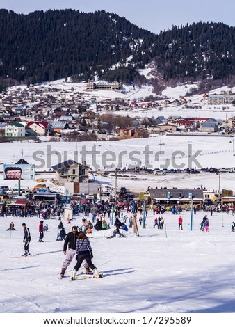 BAKURIANI, GEORGIA - JANUARY 09, 2014: People doing winter sports in Bakuriani, Georgia, on a January weekend. Bakuriani is one of two most popular skiing resorts in the country.