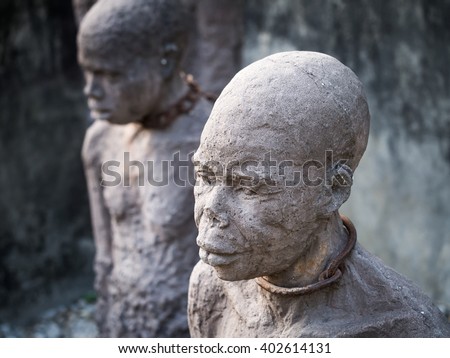 STONE TOWN, ZANZIBAR - MARCH 28, 2016: Sculpture of slaves dedicated to victims of slavery in Stone Town of Zanzibar, placed close to the former slave market.