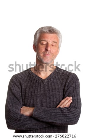 older man in a brown pullovere worth arms crossed eyes closed Isolated white background