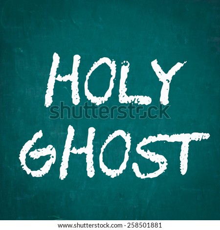 HOLY GHOST written on chalkboard