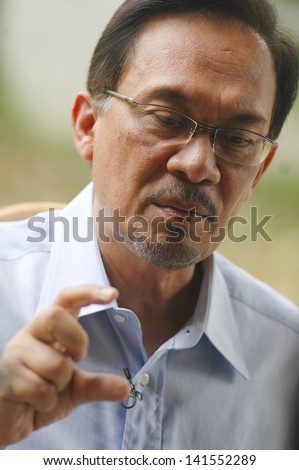 KUALA LUMPUR  - JAN 20 : Malaysian opposition leader Anwar Ibrahim speaks during an interview with Press at his office in Kuala Lumpur on January 20, 2013
