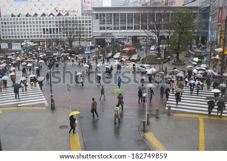 TOKYO, JAPAN - MARCH 8 : Unidentified pedestrians at Shibuya crossing on November 8, 2014 in Tokyo, Japan. The famous scramble crosswalk is used by over 2.5 million people daily.