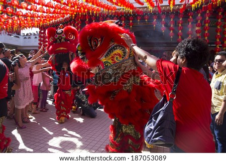 KUALA LUMPUR-JAN 31: Malaysian Traditional Lion Dance performs a dance routine outside the Thean Hou Temple during Chinese New Year celebrations on January 31, 2014 in Kuala Lumpur, Malaysia.