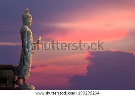 Big Buddha statue on sunset sky