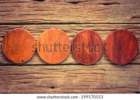 Wood circle cutting board on old wooden background