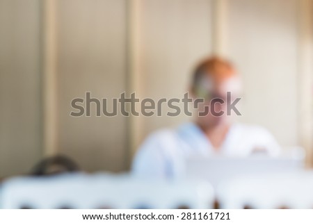 Blur Working on creative project. Cropped image of young man working on laptop while sitting at his working place