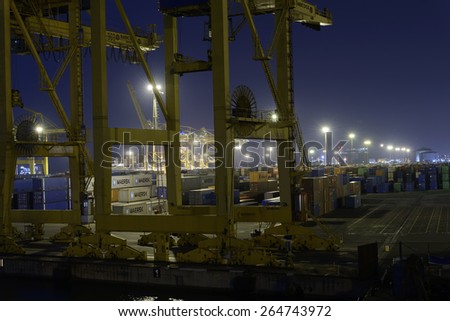 BARCELONA, SPAIN - August 10, 2014: Night view of the container port in Barcelona. It is one of the busiest container port in Europe.