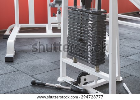 fitness weights machine in a gym room