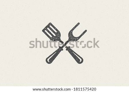 Fork and spatula crossed silhouette as symbol barbecue food preparation hand drawn stamp effect vector illustration. Vintage grunge texture emblem for bbq packaging and menu design or label decoration