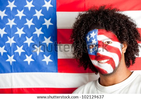 American man with the USA flag painted on his face