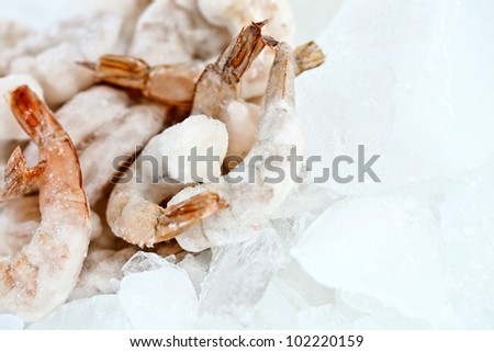 Bunch of frozen prawns on ice - seafood concepts