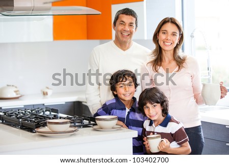 Family in the kitchen having breakfast at home