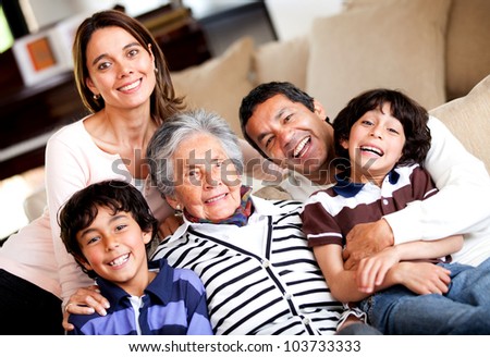 Beautiful three-generation family smiling at home
