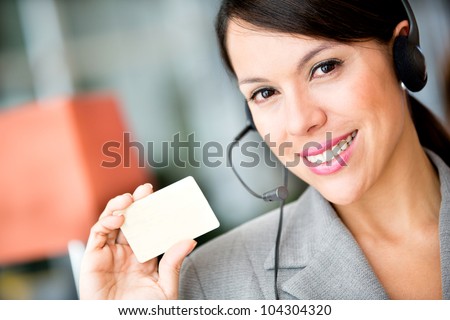 Woman holding a card to include contact detail
