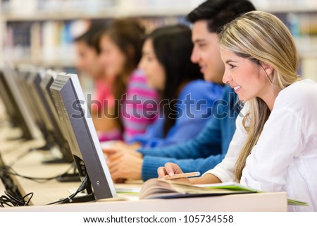 Group of young people studying online with computers