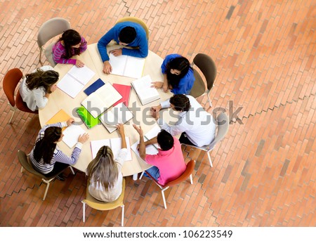 Study group with young people sitting in a round table