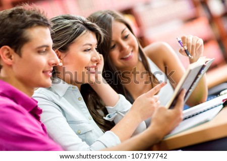 Group of young people studying with a book