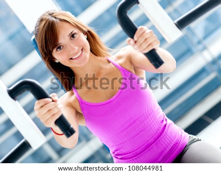 Woman at the gym working out on a machine