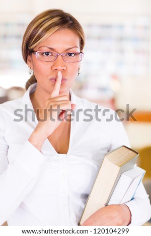 Female student asking to keep quiet at the library