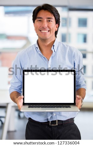 Business man showing something on a laptop screen