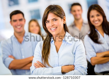 Female business leader with her team at the office