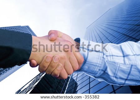 business hand shake deal in colour with a toned background to match colours family of sleeves