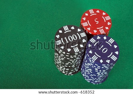 casino chips over a green felt background