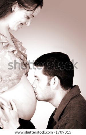 dad kissing mums belly - including clipping path to easily change the background